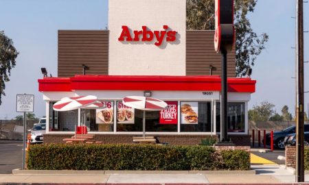 Exterior of a Arby's restaurant during arby's happy hour.